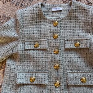 Tweed jacket in pale green with gold buttons